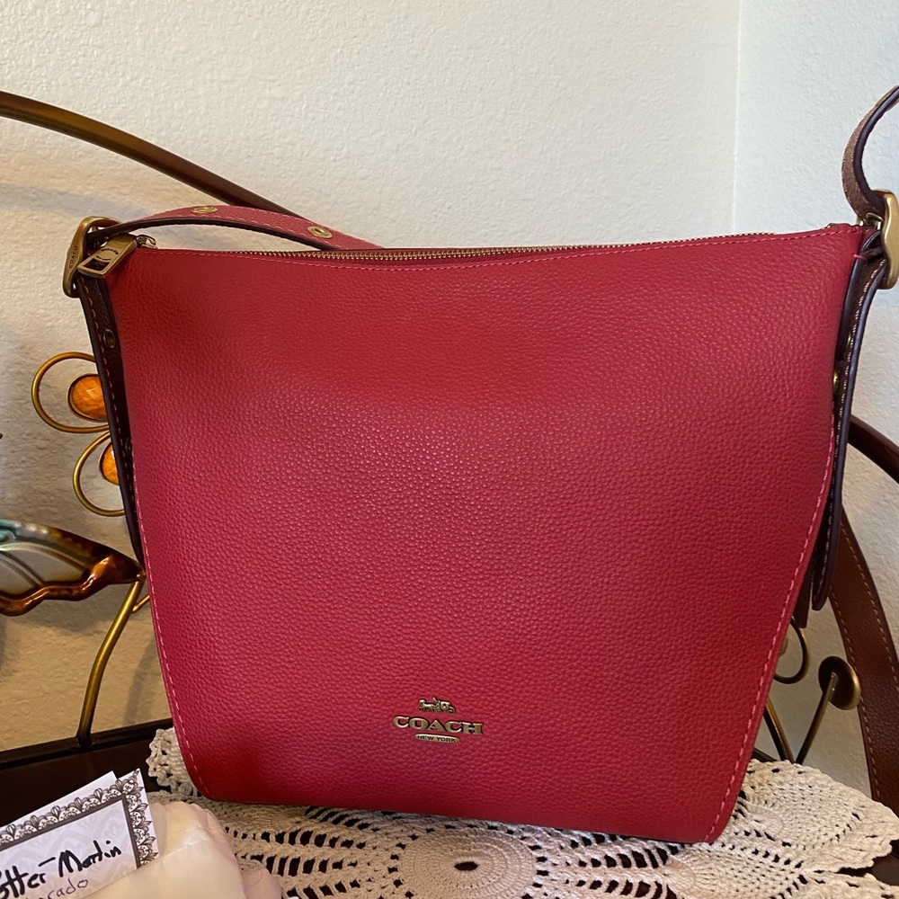 Coach bicolor reddish/cherry Dufflette bag, w/ plum contrasting sides & bottom.